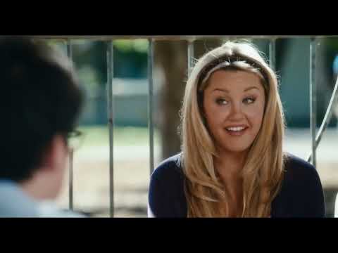 Easy A official trailer frame with Emma Stone holding a notebook in front of a chalkboard