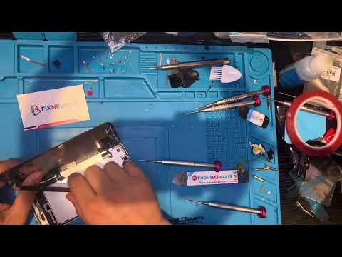 Fix 'N Repair technician repairing a device