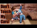 Brothers Fighting Over Toy Cars