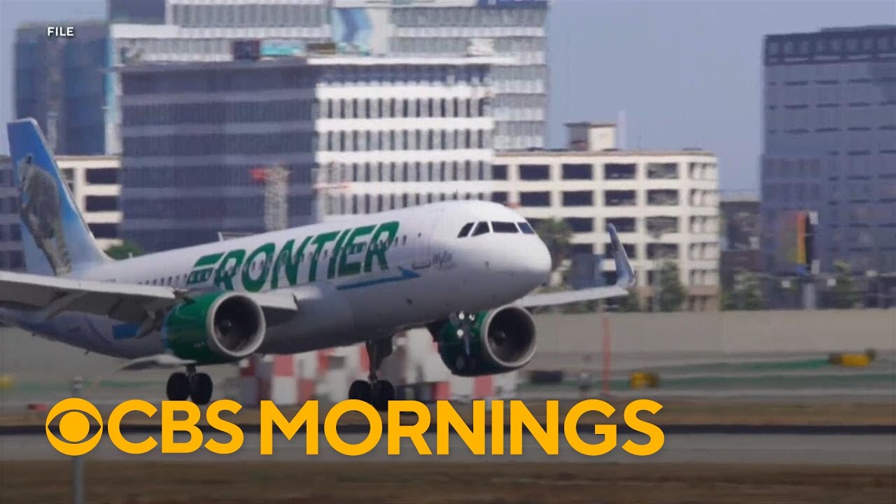 FAA investigating close call between plane and two trucks at LAX