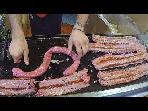 Metre-Long Sausages Roasted Austrian Style. Street Food Festival in Italy