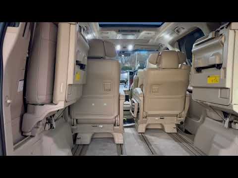Part of a video titled How to fold up the rear seats on a Toyota Vellfire or Alphard series 20 ...