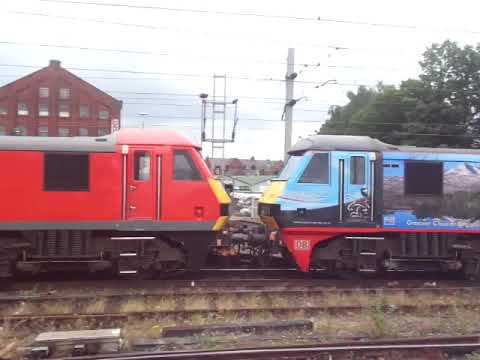 The x2 Class 90 DB Cargo UK Nos.90024+90035 with Rail Containers was passed through at Carlisle.