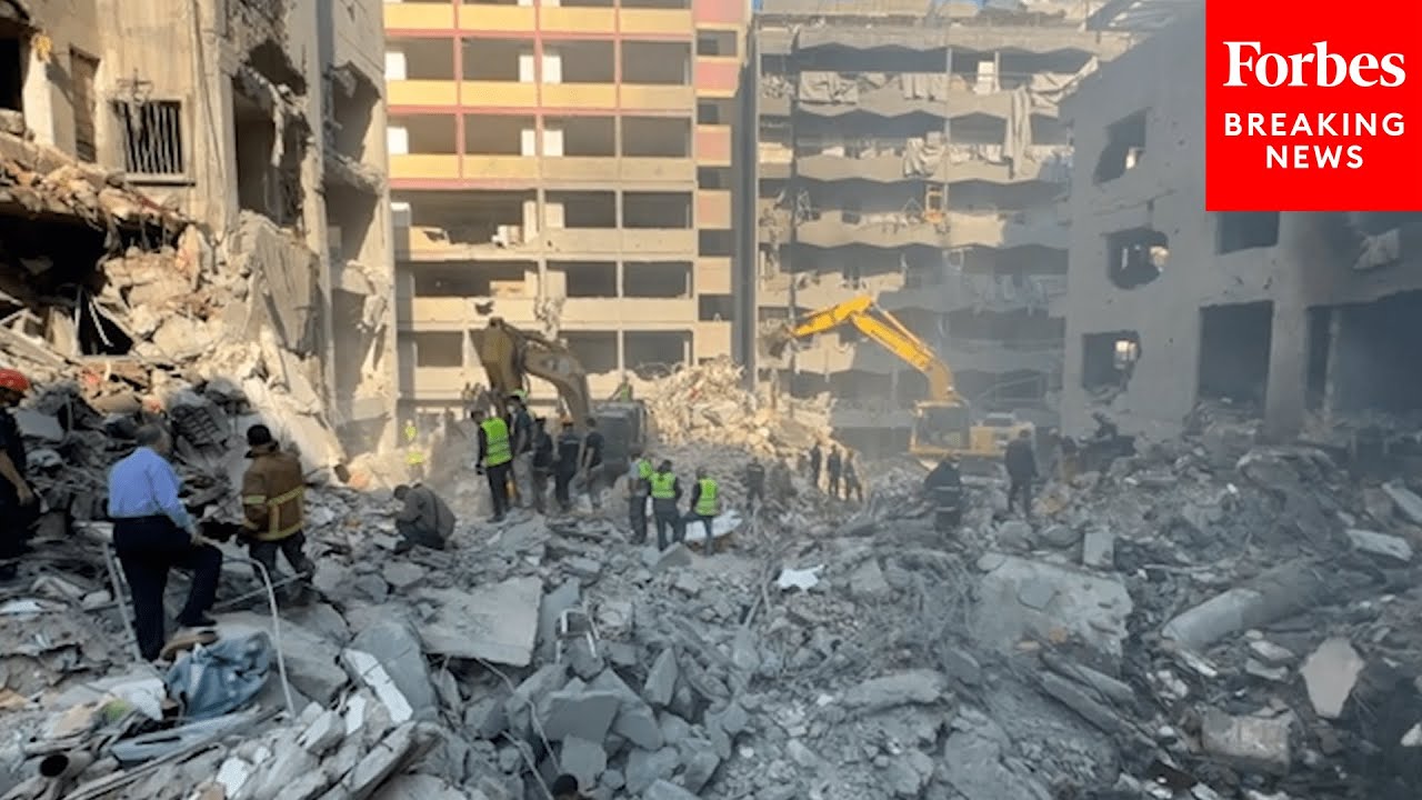 Emergency Personnel In Southern Beirut Deal With The Aftermath Of An Airstrike Conducted By Israel