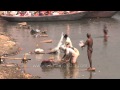 Heavily Polluted Ganges River Washing Clothes And Bathing In Varanasi