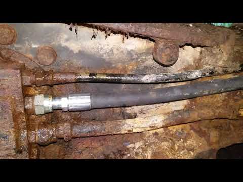 Caterpillar e70b track drive motor hydraulic line repair part 2