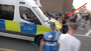 Police van 'RUNS DOWN' protester during night of clashes outside migrant hotel: Disorder in Epping