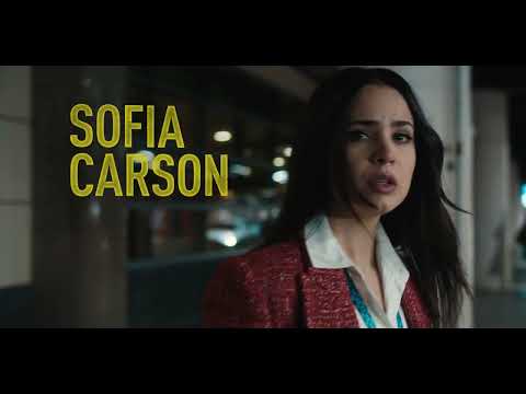 Carry-On trailer frame with holiday decor juxtaposed against TSA scanners