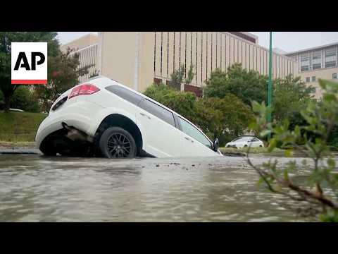 Virginia police officer rescues a woman whose vehicle fell into a sinkhole