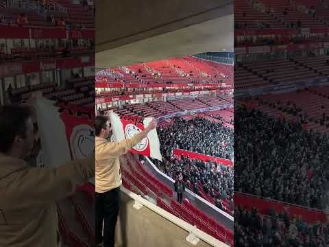 An Ajax fan against PSV fans in Emirates