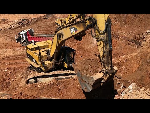 Two Caterpillar 365C Excavators Loading MAN And Mercedes Trucks