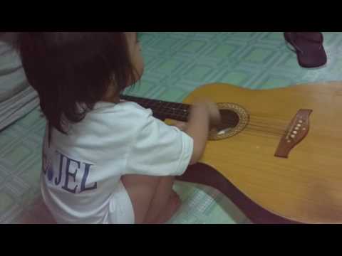 Akhi Rich Neijel - playing guitar