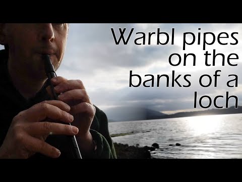 Warbl electronic penny whistle on the bonny banks of a Scottish loch
