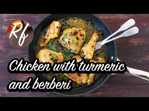 Baked chicken with turmeric, butter, onion and berberi garnished with chopped parsley. >