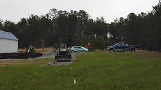 Larry and John Deere making me a new back yard driveway