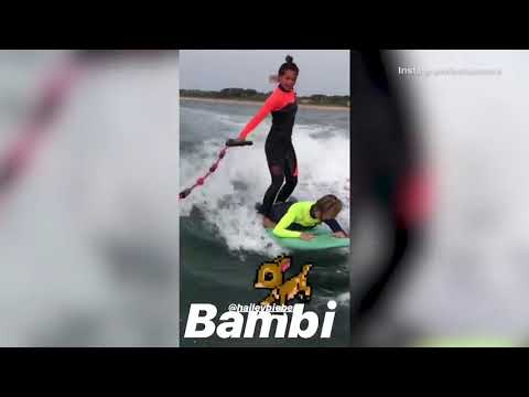 Pro-surfer Kelia Termini tries to help pal Hailey Baldwin surf