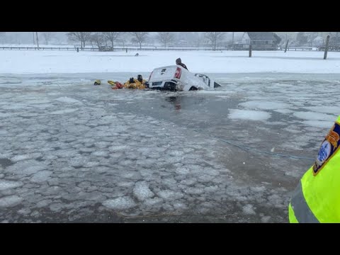 CT firefighters rescue 2 from submerged truck in snowstorm