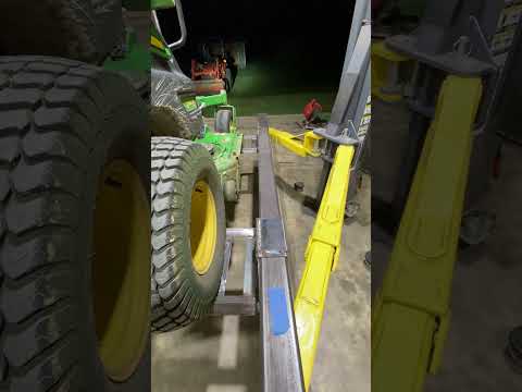 Equipment Lift Adapter for lawn mowers or tractors using a 2 post car lift.
