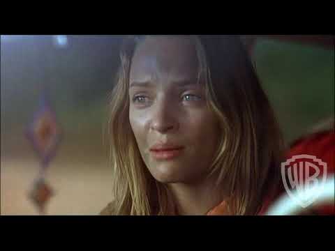 Trailer frame hinting at Rubber Rose ranch standoffs, scored with k.d. lang’s playful cues