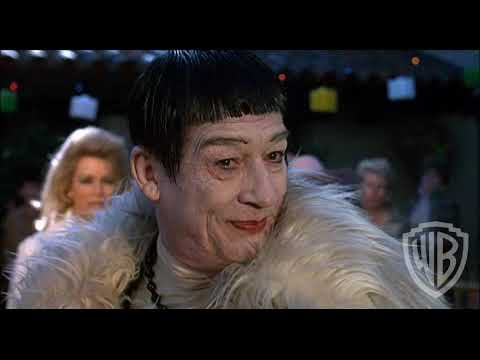 Trailer collage of open road and ranch imagery suggesting the score’s hybrid of club beats and prairie motifs