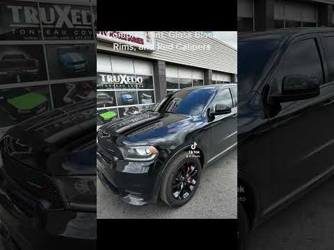 Complete tint, Gloss Black Plasti Dipped Rims, and Red Painted Calipers on this Dodge Durango.
