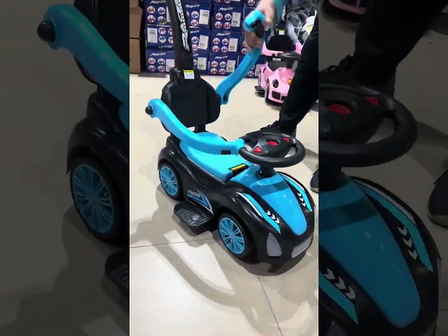 سيارة اطفال دف برتقالي اسود بعصا