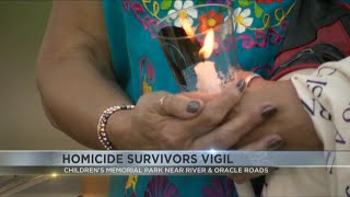 Dozens pay respect to violent crime victims in touching vigil