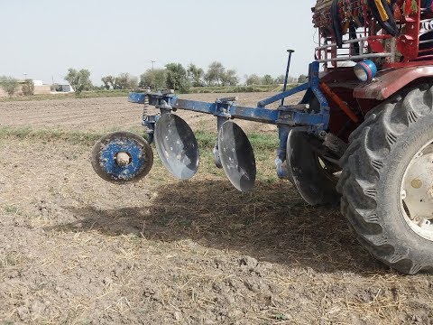 Mounted type disc plough working in the field