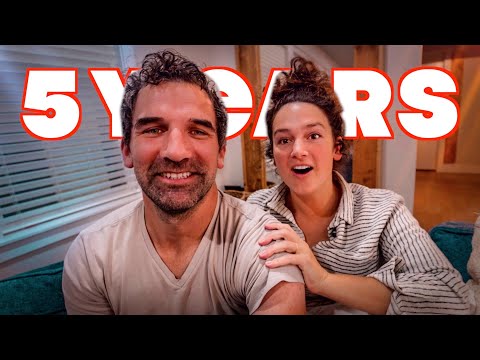 Smiling couple on a couch with bold red '5 YEARS' text overlay, suggesting an anniversary video.