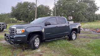professionally changing spark plugs in a GMC Canyon 3.6