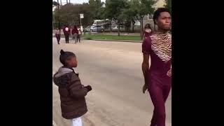 Stan Twitter: A little girl watching a feminine man as he walks by