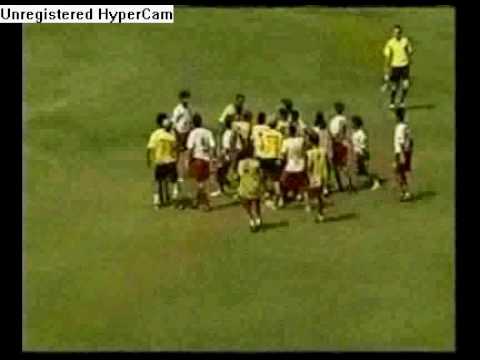 arbiter hits soccer player