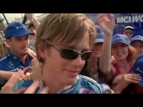 Driven (2001) trailer frame: Champ Car grid under stadium lights, soundtrack-forward edit
