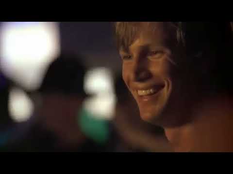 Driven trailer frame: pit stop under floodlights, thumping breakbeat feel