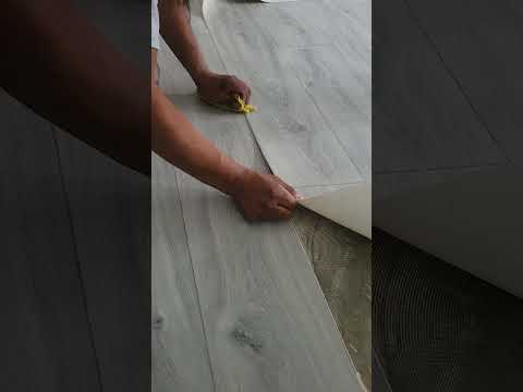 Part of a video titled How to Seam Sheet Vinyl Flooring #homeimprovement #shorts ...