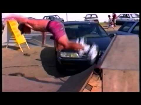 Kelly Slater tries to teach Tom Carroll skateboarding