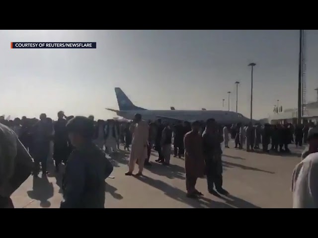 With Kabul airport closed, fearful Afghans rush for the border