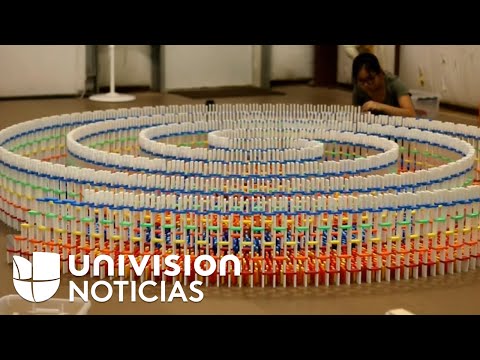 The domino effect made into art in a triple spiral built with 15,000 dominoes