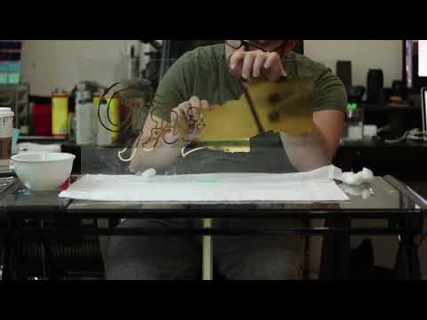 "Trouble" Sign: Removing Excess Gold Leaf