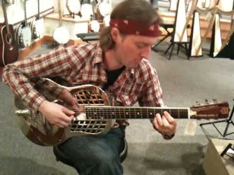 Me in Seattle playing perhaps the most expensive guitar I've ever held.