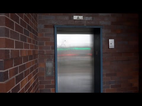 Glass Dover Hydraulic Elevator at the Cobb Galleria Pedestrian Bridge in Atlanta, GA