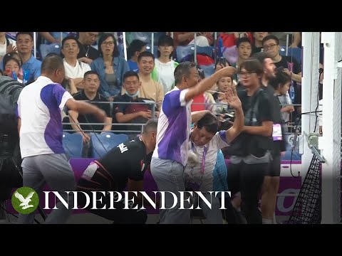 Asian Games official suffers horrific leg break after being hit during hammer throw