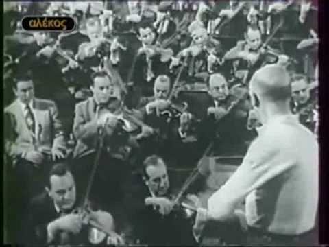 Ο αρχιμουσικός [[#Δημήτρης Μητρόπουλος#]] διευθύνει τη [[#Φιλαρμονική της Νέας Υόρκης [New York Philharmonic]#]]