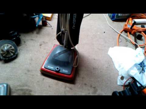 Sanitaire sc684 cleaning up after a Bissell.