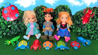 Searching for bugs ! Elsa & Anna toddlers - Barbie dolls - fun outside