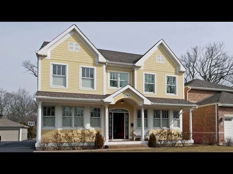 A like-new Nantucket-style home in center-of-town Elmhurst