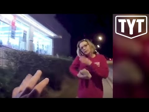 Woman Threatening Cops With Rock