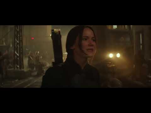 Mockingjay – Part 2 trailer still: Katniss steps into the light with the rebellion crest behind her