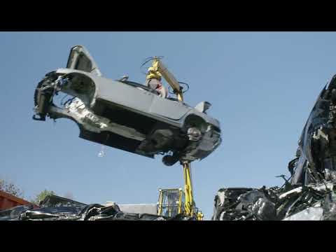 Car Dismantling and Scrap Processing - Car Compactor Area - Crushing of Remaining Vehicle Body