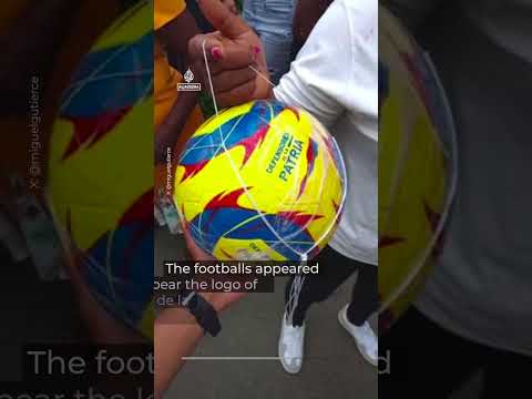 Outrage as Colombian president hands out footballs while residents await aid | AJ #shorts